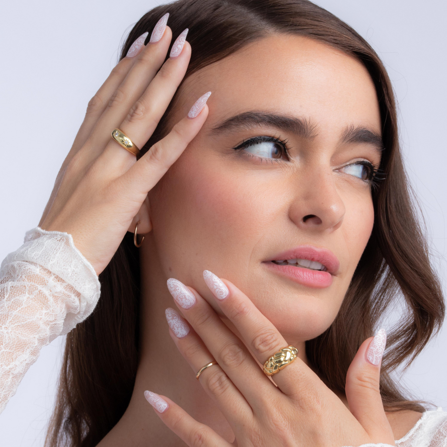 Woman using Beige Lace Almond Press On Nails